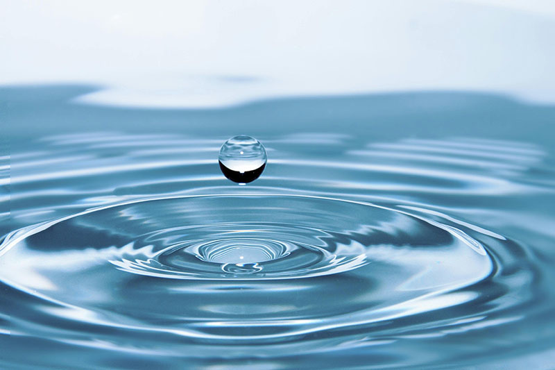 water drop above ripples