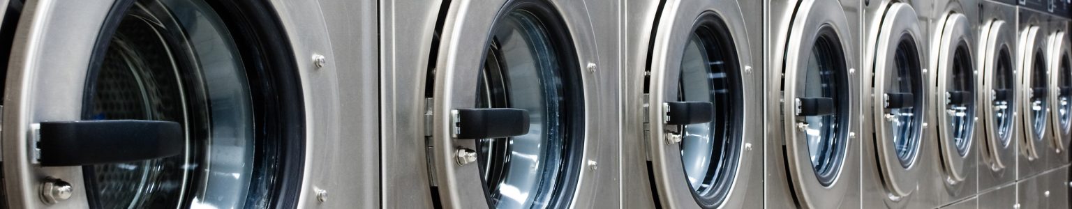 Row of washing machines at a laundromat