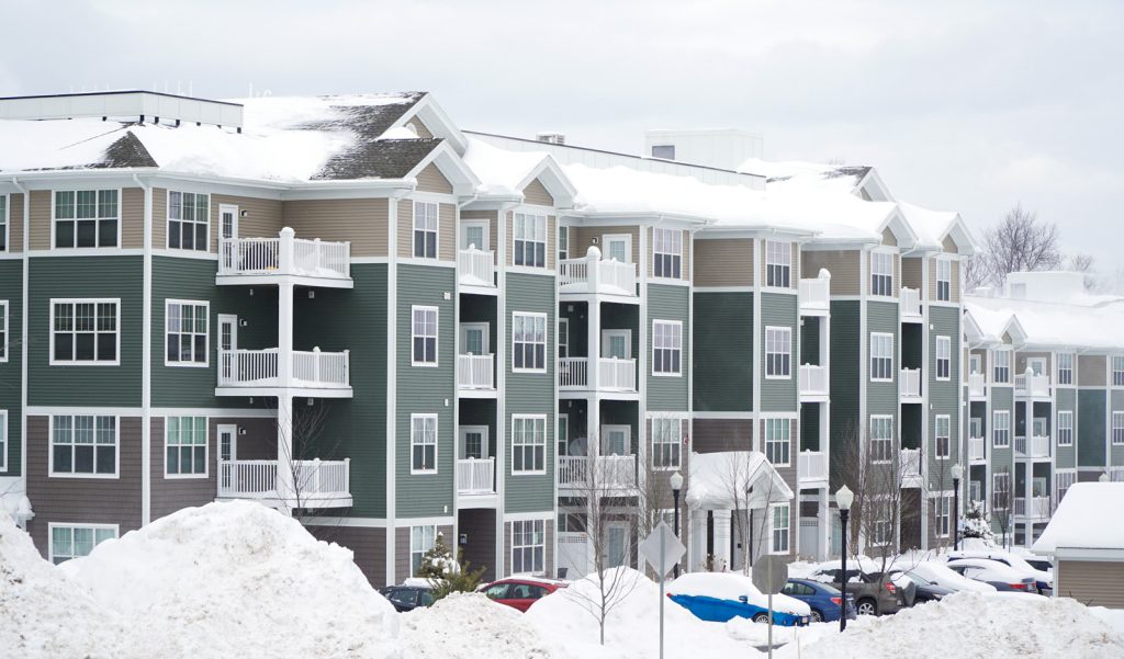 Apartment building with snow