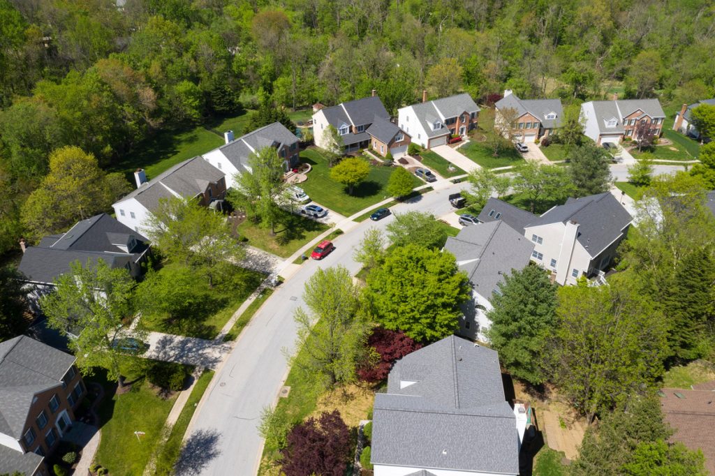 Aerial view of a neighborhood among trees