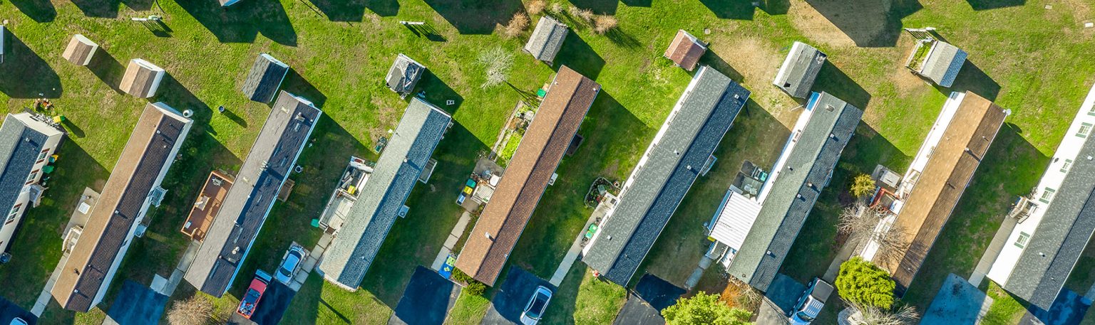 Aerial view of a row of homes in a mobile home park