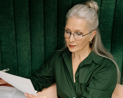 Stock image of a woman reading a document