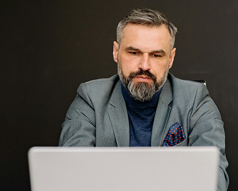 Stock image of a businessman using a laptop